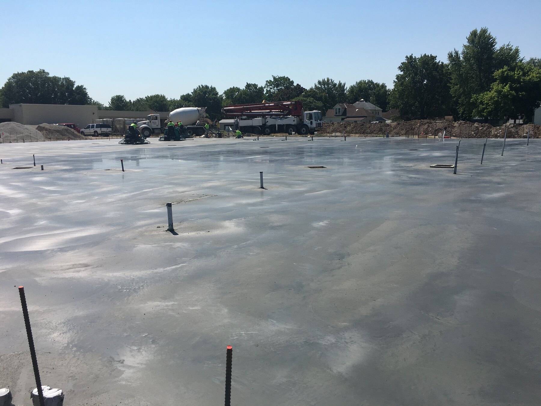 Crew finishing the newly placed concrete slab at the G&W Foods project in Iola, Kansas