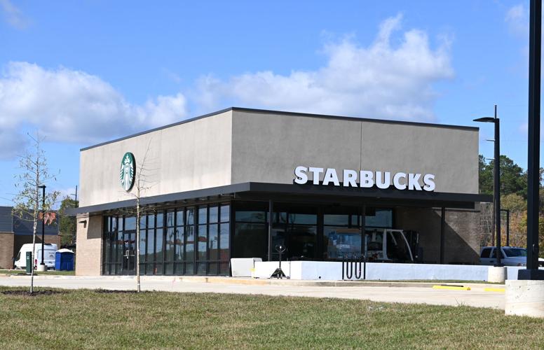 Completed Starbucks exterior with storefront glazing, entrance canopy, and signage in Jasper, Alabama